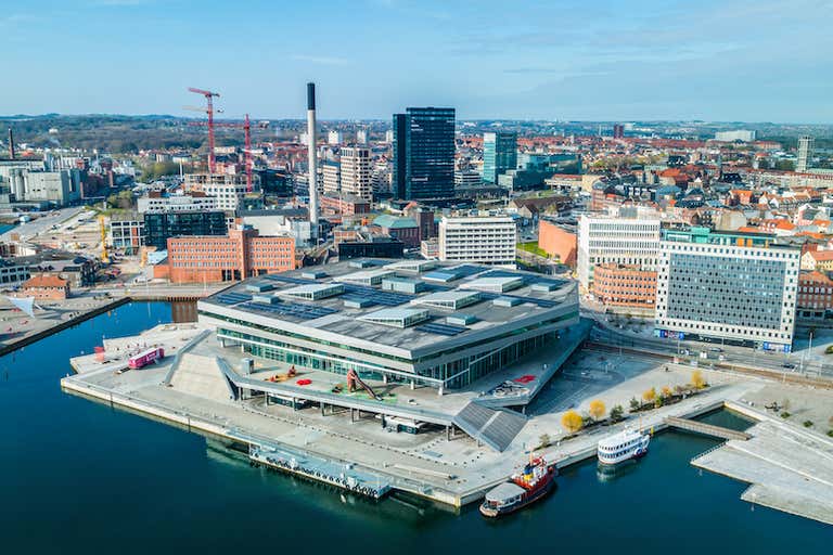 Aerial view of Dokk1 in Aarhus, Denmark, with surrounding cityscape.
