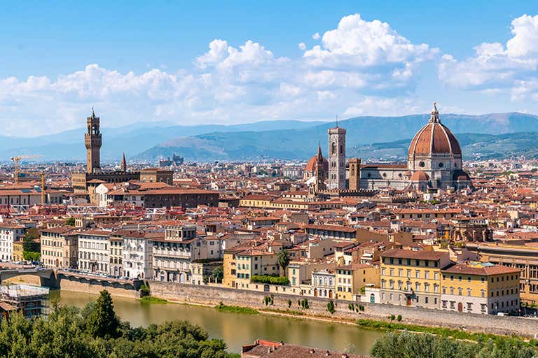 A panoramic view of Florence, Italy, featuring the Duomo and Arno River.