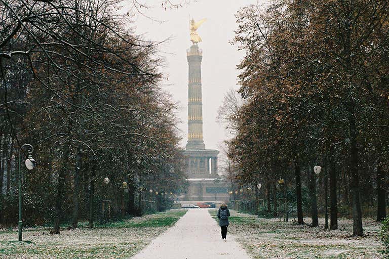 A snowy path in Tiergarten, Berlin, leading to the Victory Column in February.