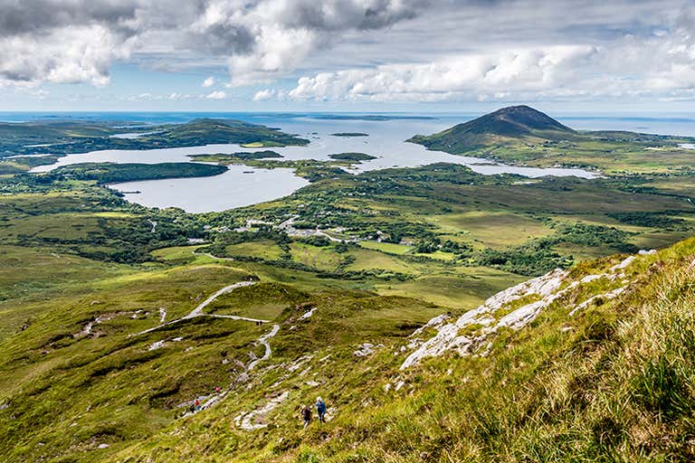 View from Diamond Hill overlooking Connemara National Park’s green hills and coastal inlets.