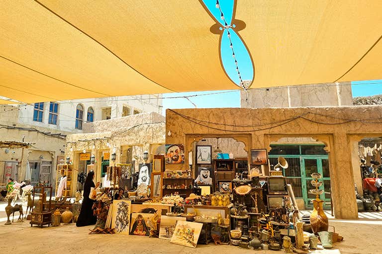 Al Fahidi Historical District with traditional wind towers and narrow alleys.