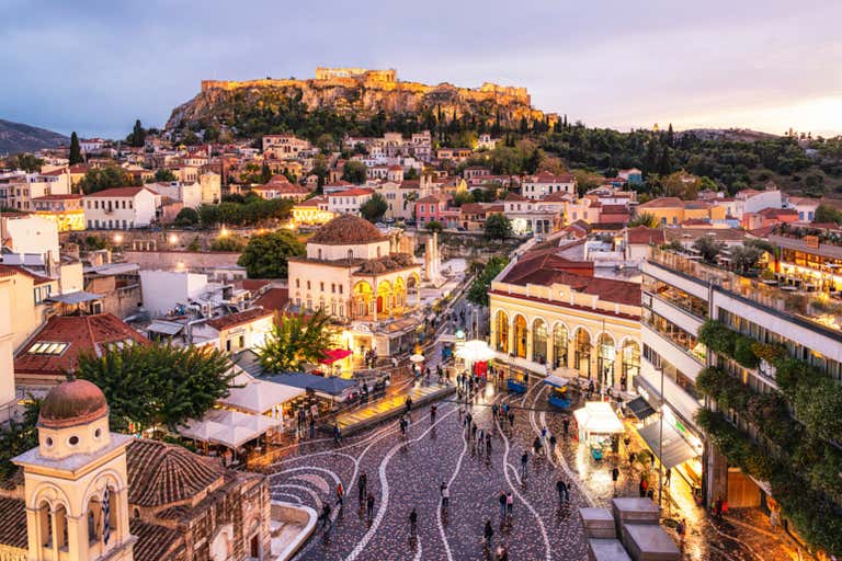 Adrianou Street, a lively area with shops and views of ancient ruins.