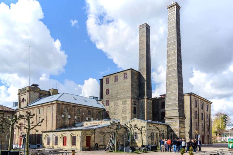 Historic Carlsberg Brewery with its distinctive twin chimneys and industrial brick architecture, a unique Copenhagen cultural site