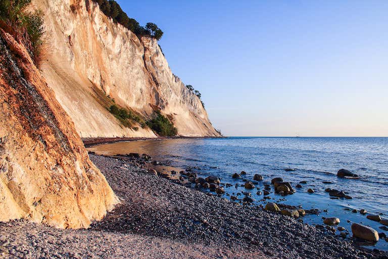 A scenic view of the white chalk cliffs at Møns Klint in Denmark.