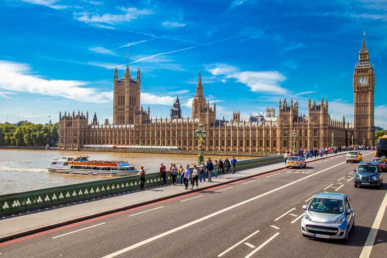 View of the Palace of Westminster and Big Ben from Westminster Bridge in London.