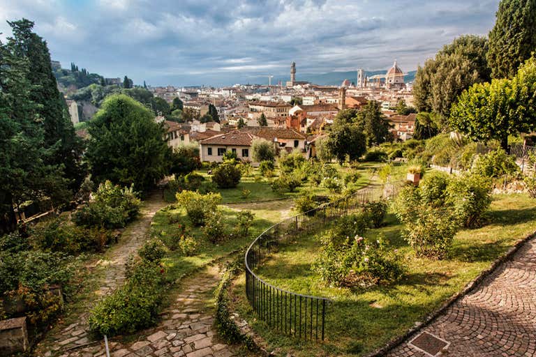 A scenic view of Florence from the Rose Garden, with the city skyline and the Duomo in the background.