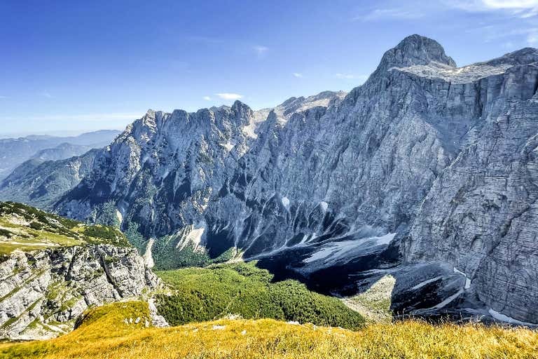 Triglav mountain peak in Julian Alps, Slovenia, under clear skies.