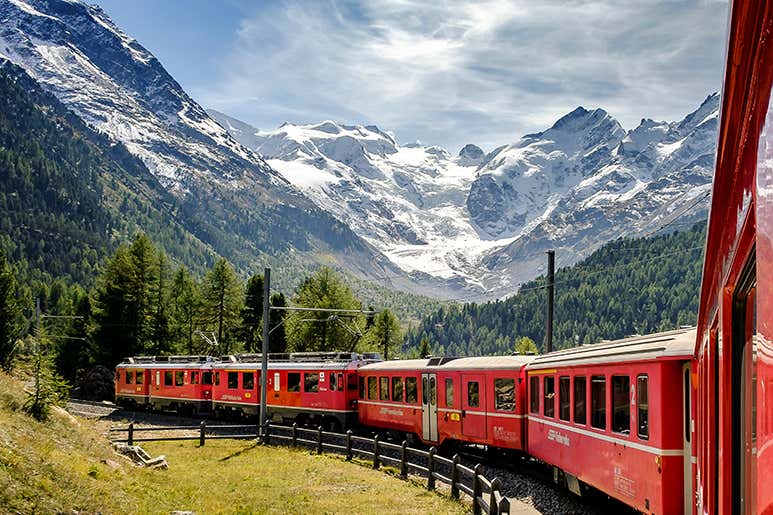 Red Bernina Express train crossing the Alps between Italy and Switzerland.