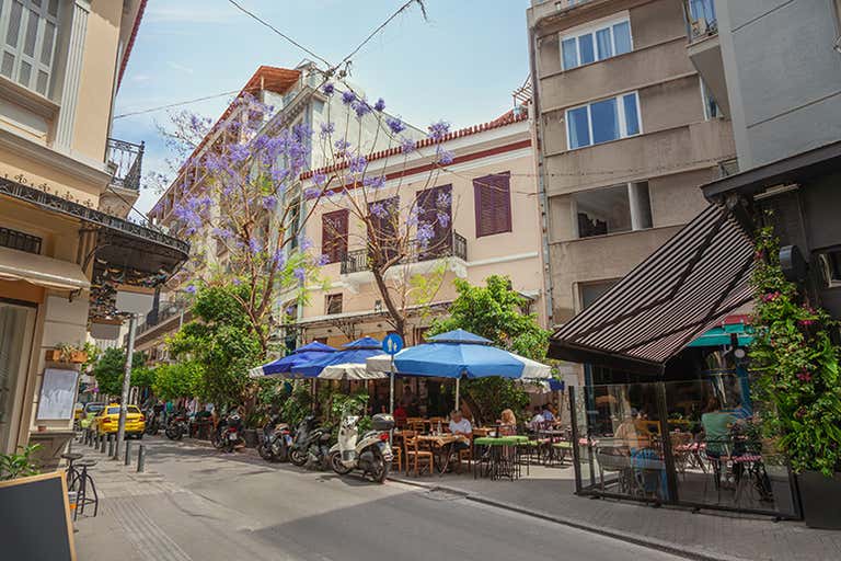 People sitting at a cafe on Aiolou Street
