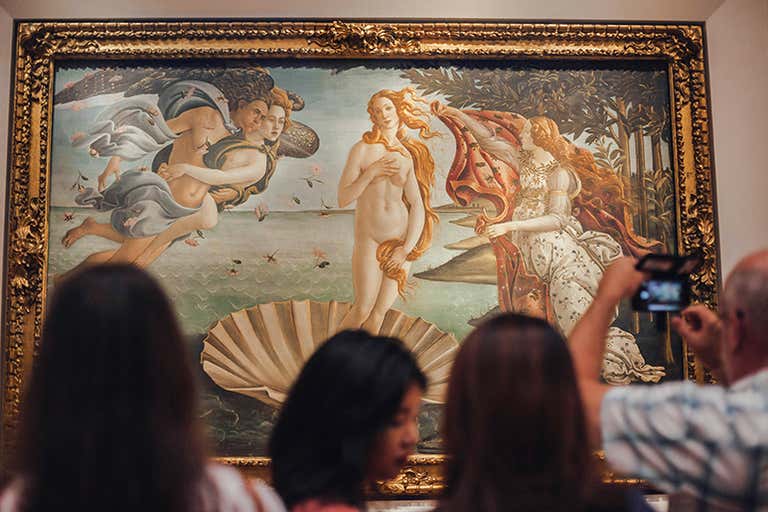 Visitors admire Botticelli's 'The Birth of Venus' at the Uffizi Gallery.