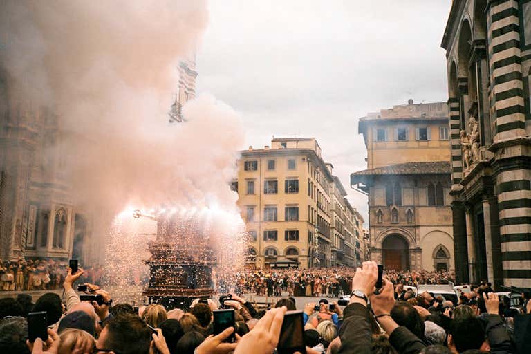 A crowd gathers in Florence to watch a traditional Easter event with fireworks.