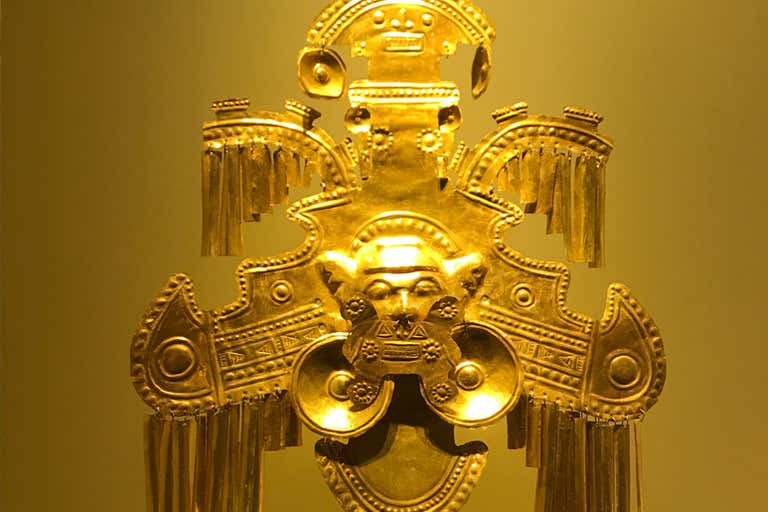 A gold artifact from Bogotá's Gold Museum, featuring intricate pre-Columbian designs and detailed craftsmanship.