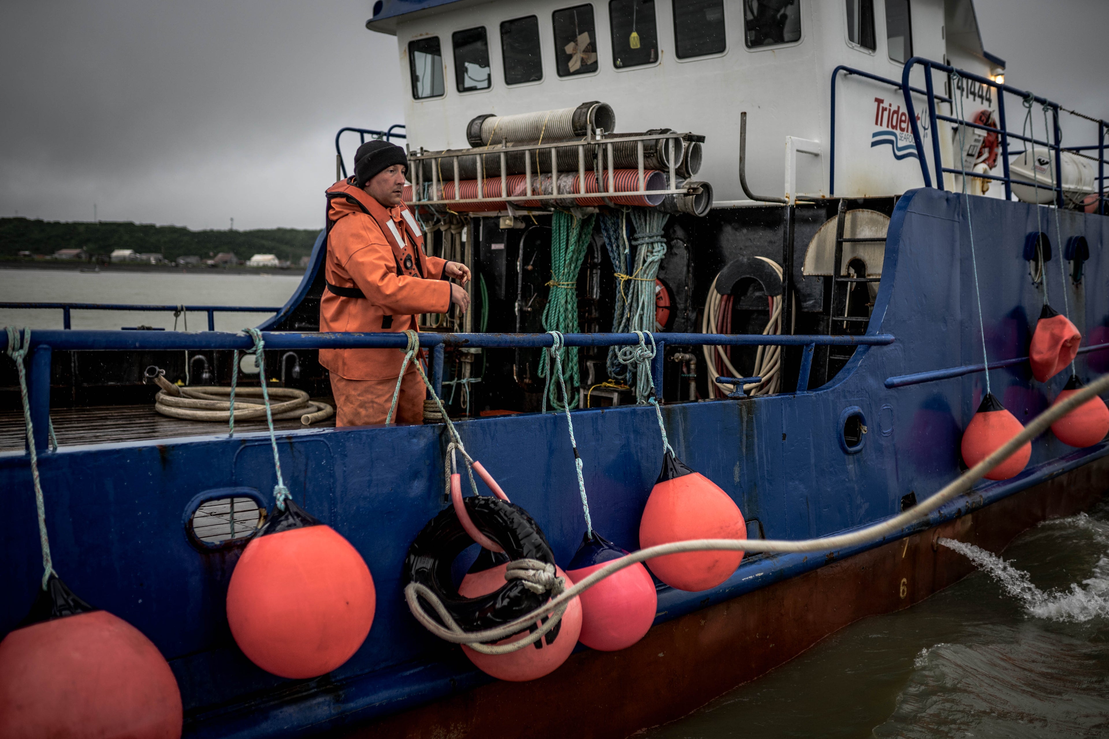 Fisherman on deck of vessel