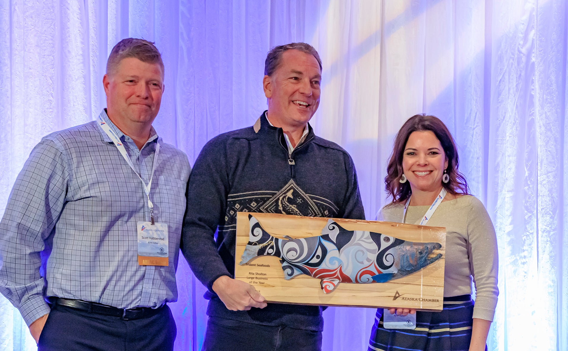 Trident Seafoods CEO Joe Bundrant (center) accepts Alaska Chamber Rita Sholton Large Business of the Year Award. Also pictured, Scott Habberstad of Alaska Airlines and Kati Capozzi of Alaska Chamber.