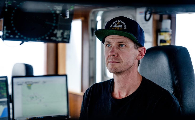 Captain Gus Molan, at the helm of F/V Northern Patriot, monitoring navigation and radar