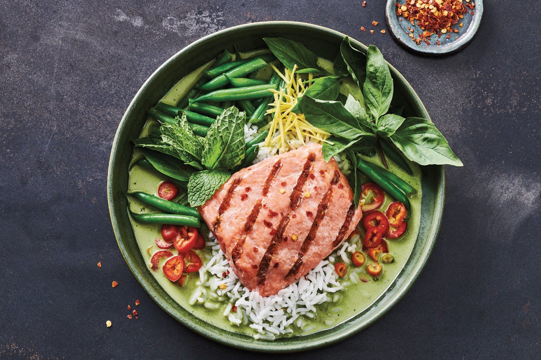 Grilled salmon sandwich on a bed of rice, with grean beans, basil, and fresno chilis. 
