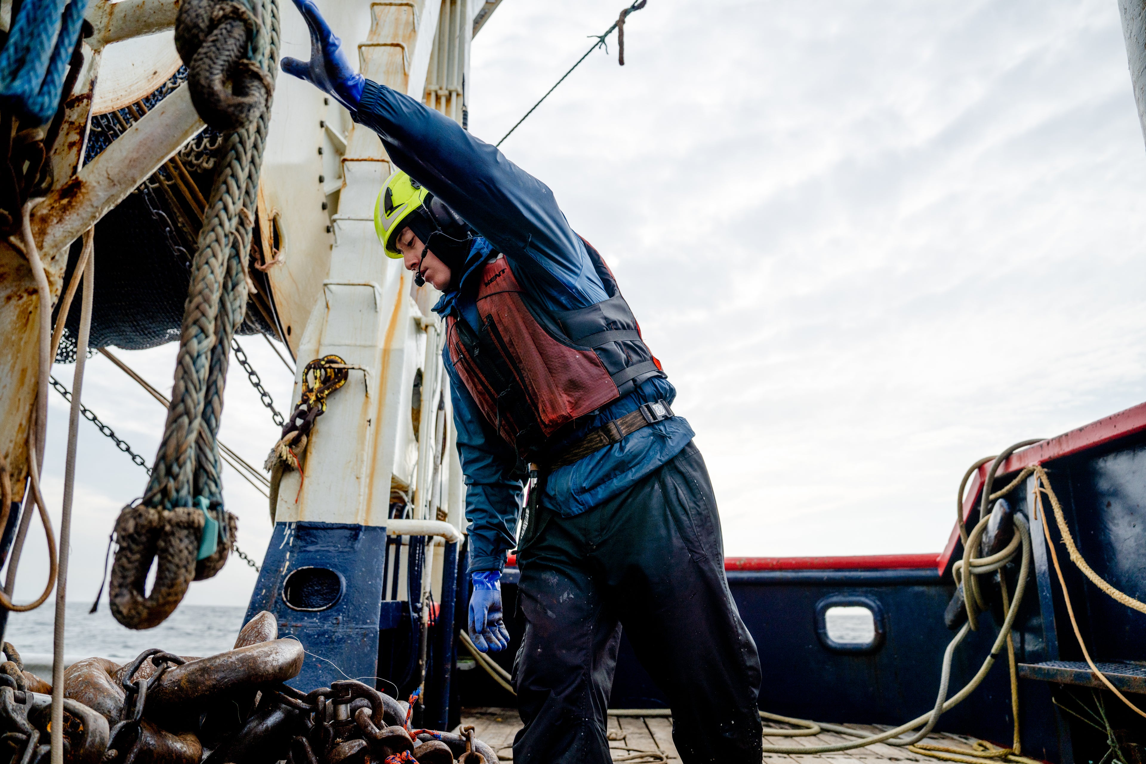 Deckhand and trawl trainee, Emory, setting the trawl net.