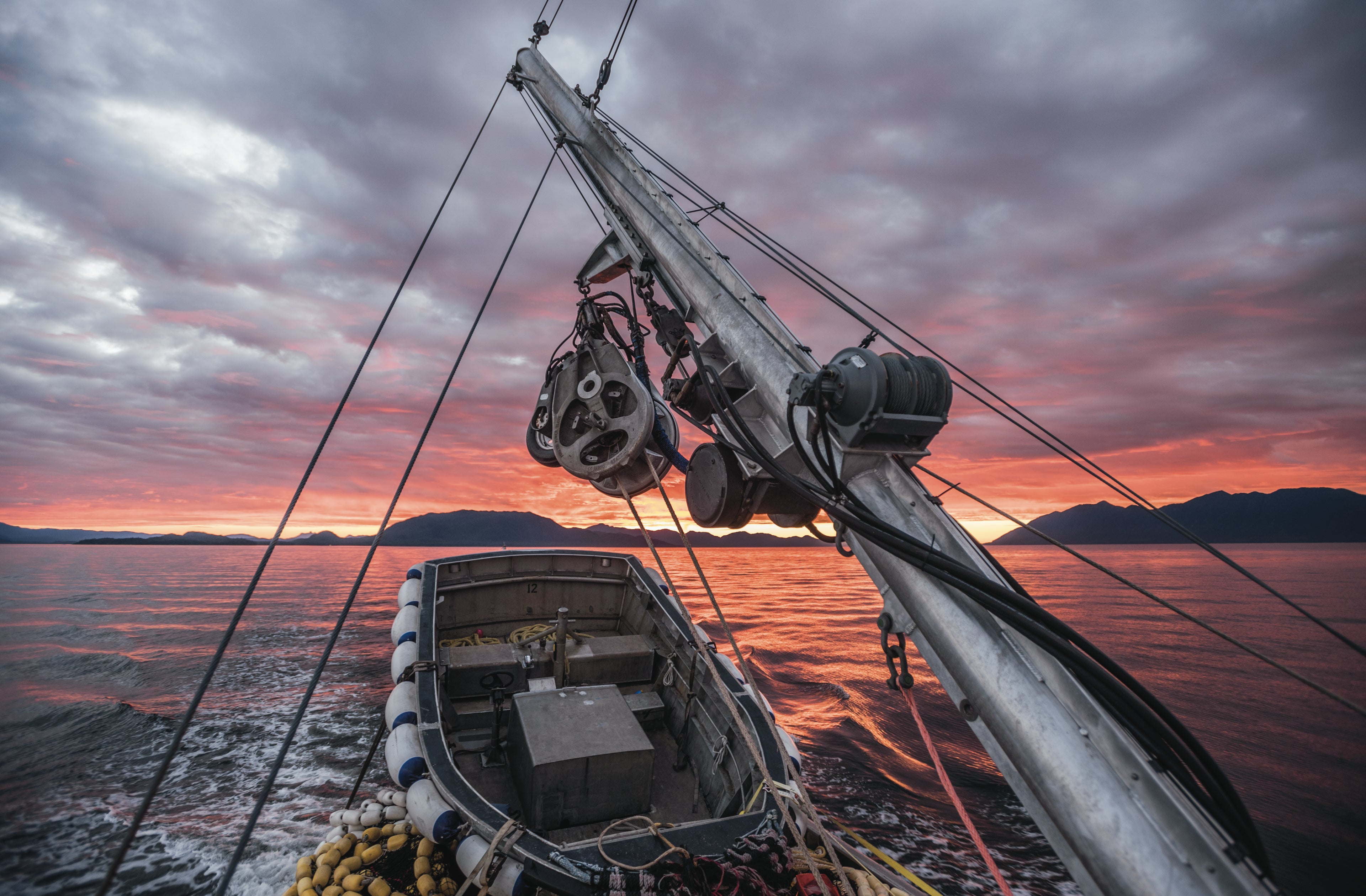 Purse seiner back deck with sunset in the background