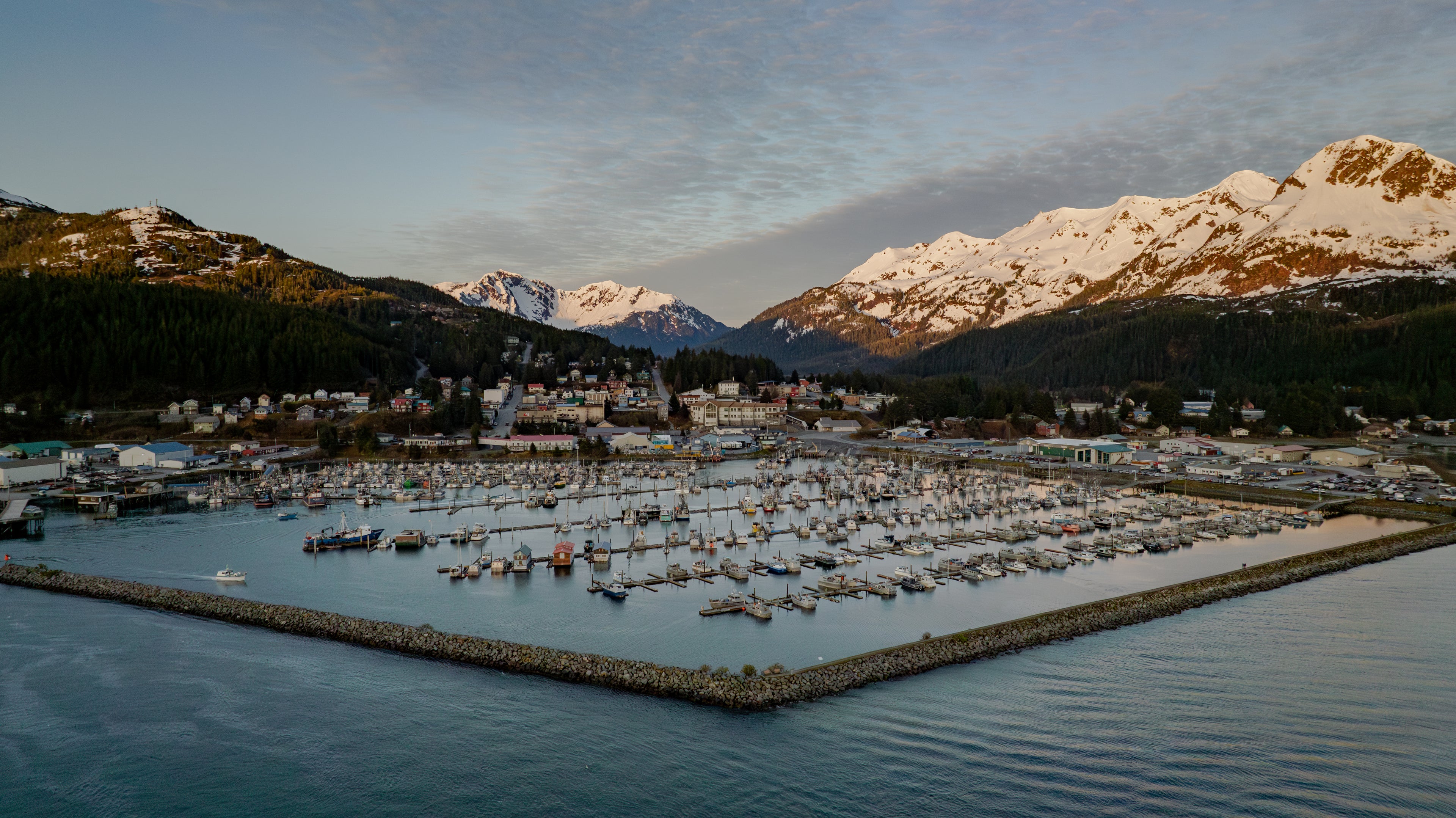 Cordova, Alaska harbor with mountains in the background. 