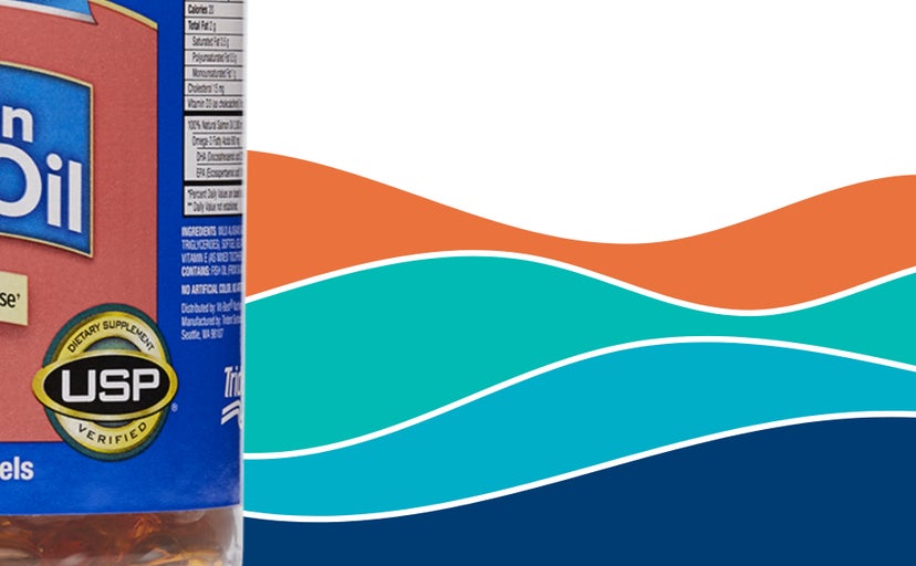 A bottle of Pure Alaska Omega wild Alaska salmon oil pills sits against an illustration of orange and blue waves