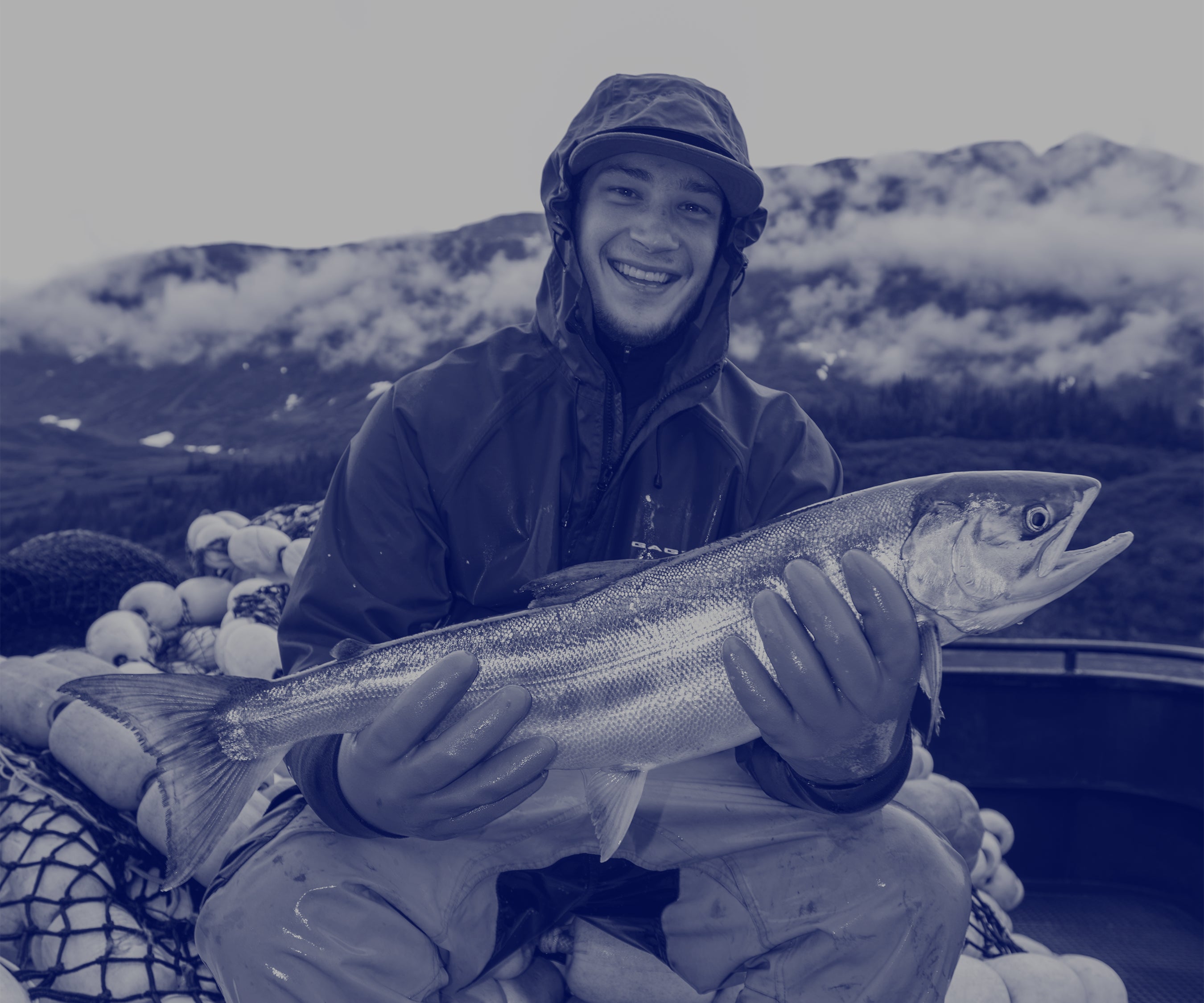 Fisherman holding a Salmon