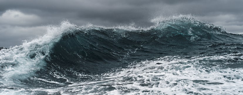 Waves folding over in a dark and stormy sea