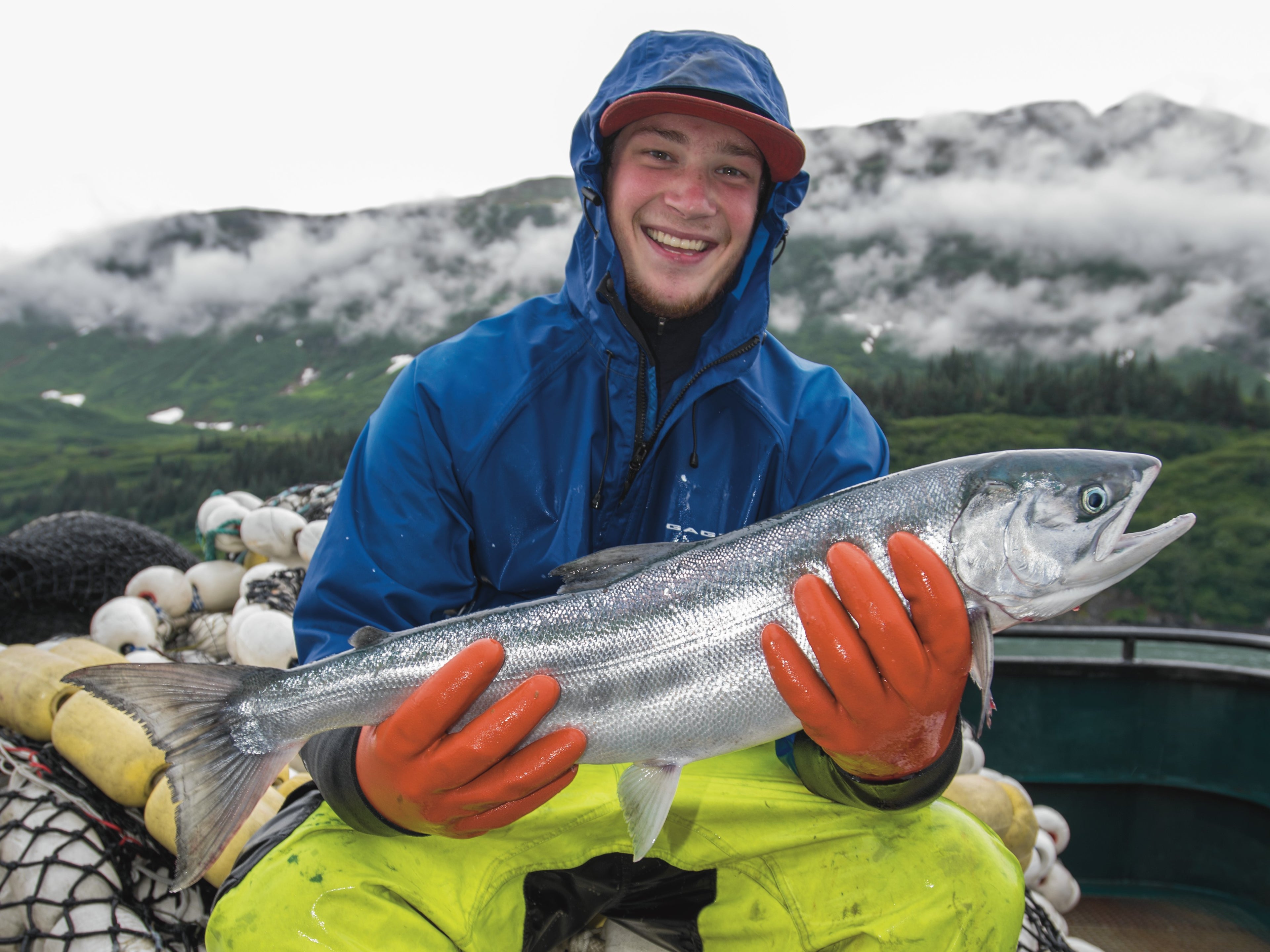 Fishermen holding a salmon