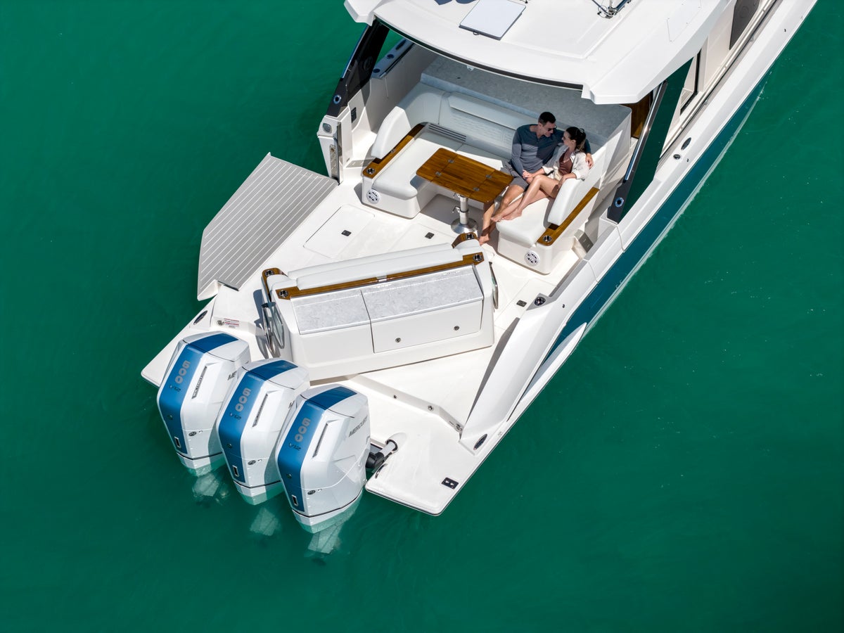 Tiara Yachts 46 LS Drone Aerial Stern View of Mercury Motors and Buffet Lounge Module