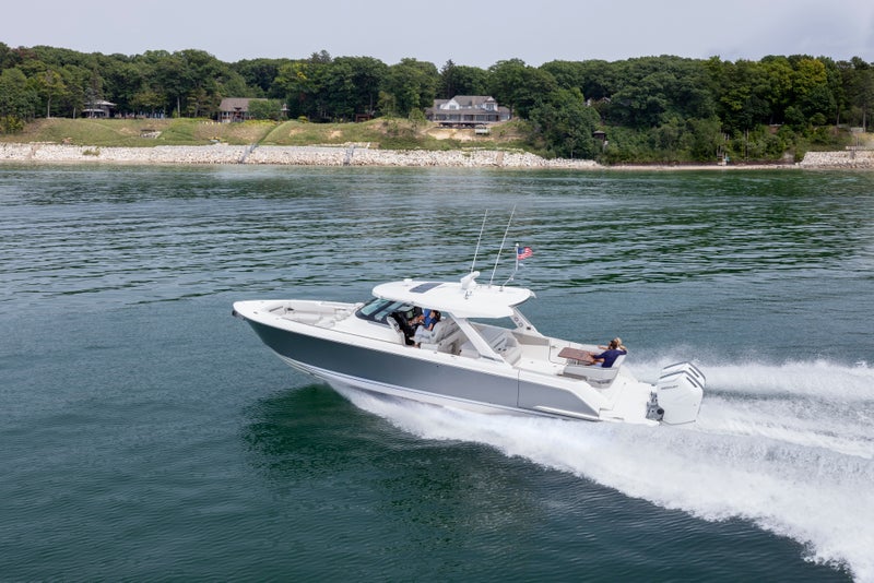 Tiara Yachts 43 LS running to port, Bright Silver hull color