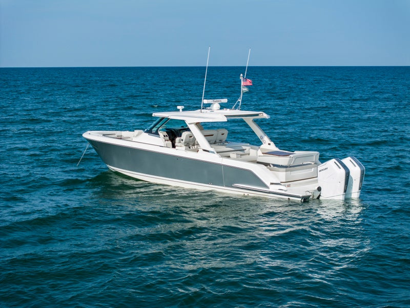 Tiara Yachts 43 LS at anchor, Bright Silver hull paint