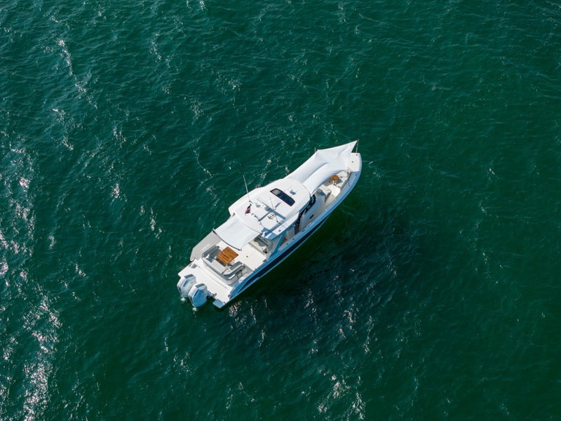 Tiara Yachts 43 LS with cockpit and bow sun shades deployed