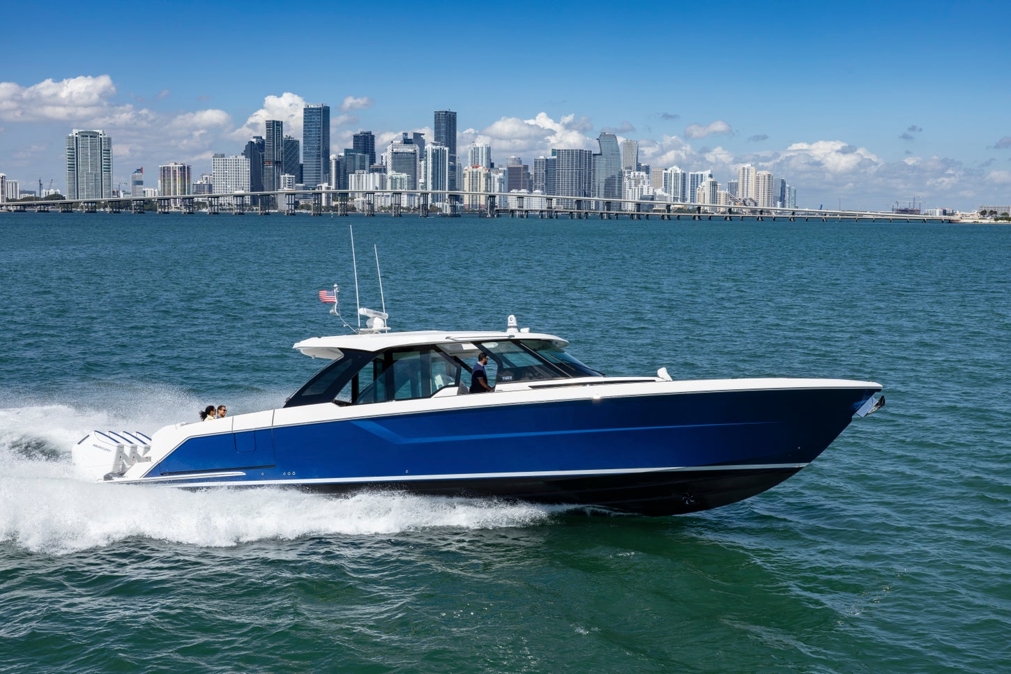 56 LS Running to Starboard with Miami skyline in background - Hull Color: Estoril Blue