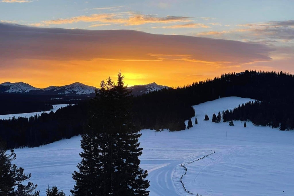 Meadowlark Ski Lodge - The sun sets over a snow-covered landscape