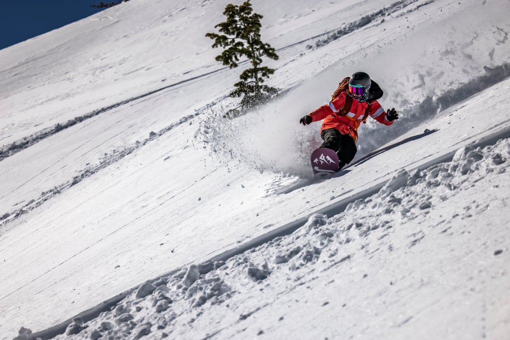 Snowbird_Snowboarder Carving Deep Powder_(c): Jay Dash