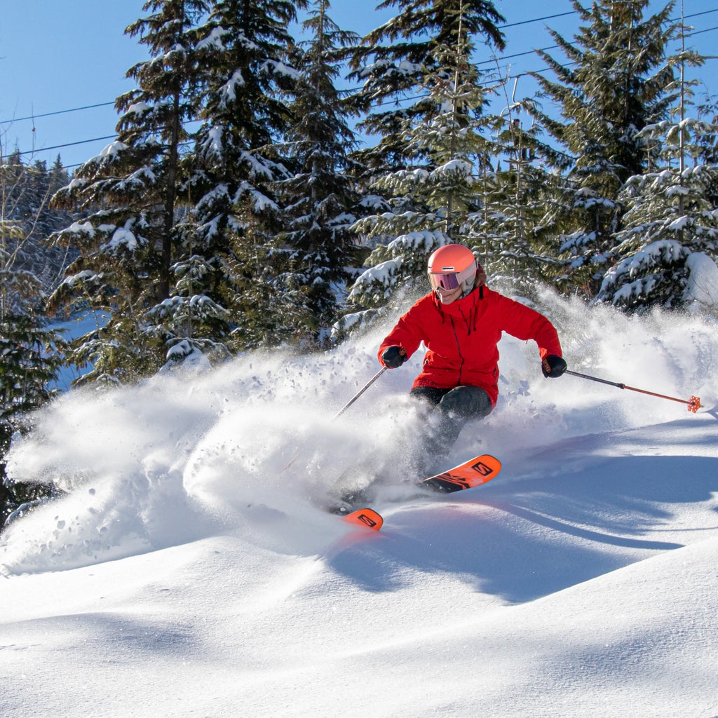 49 Degrees North Snowboarder in Powder