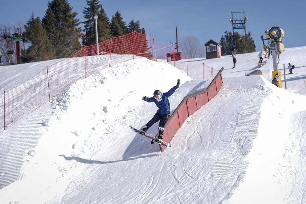 Little Switzerland - snowboarder descends a snow ramp