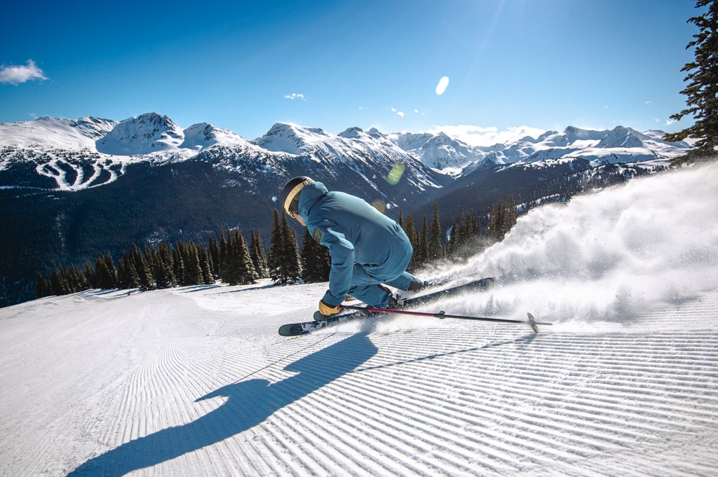 Whistler Blackcomb_Fresh Snow_Skier Groomed Carve_(c): Tourism Whistler/Guy Fattal