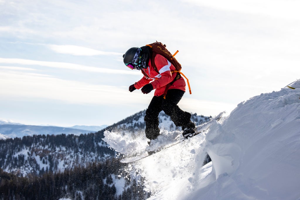 Snowbird_Snowboarder Taking Off_(c): Jay Dash