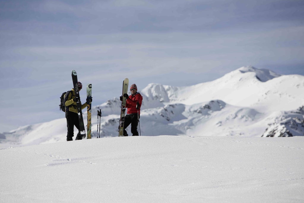 A pair of skiers ready to descend Val Senales, Italy.