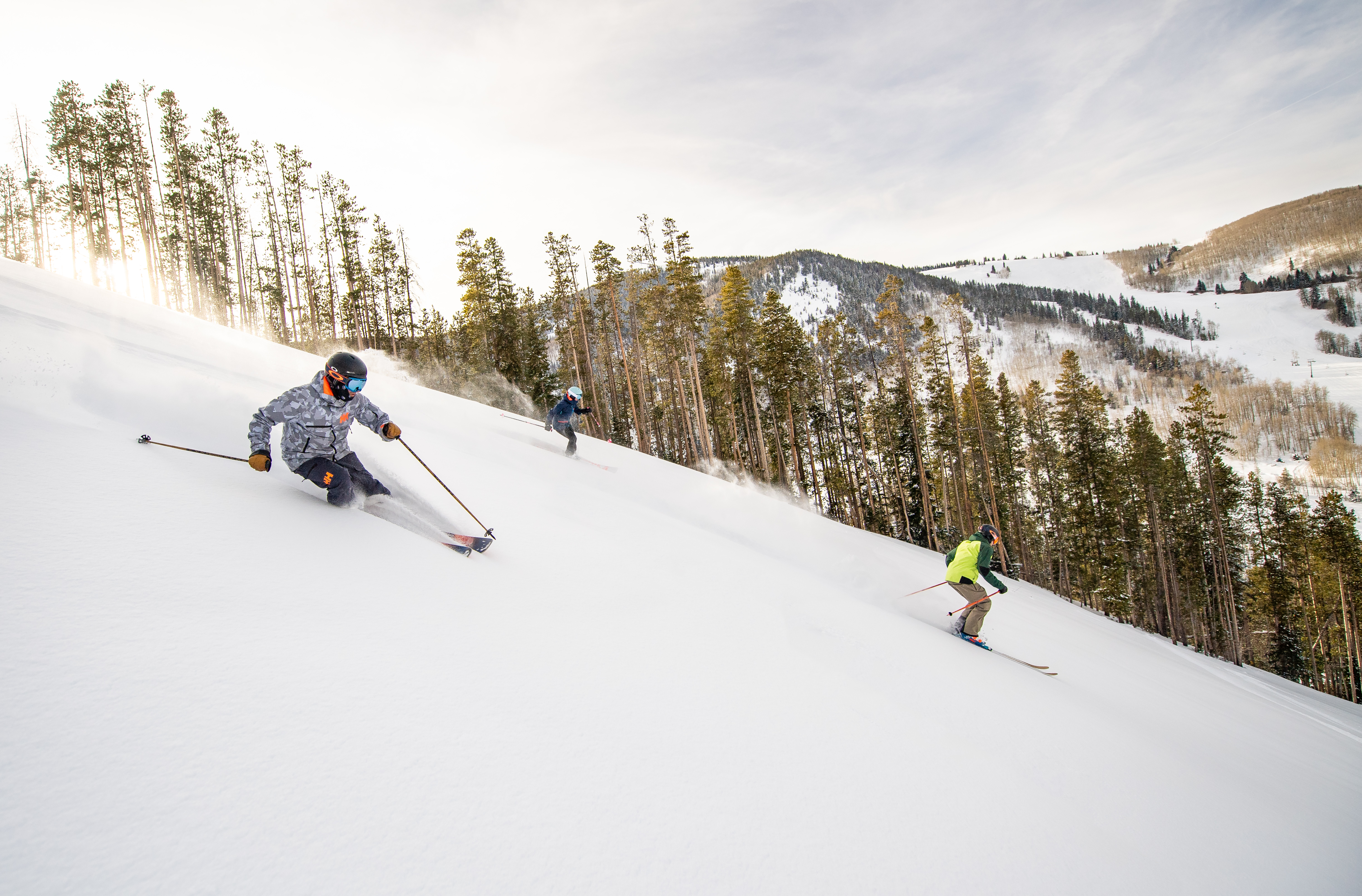 Group of skiers skiing down slopes at Beaver Creek.