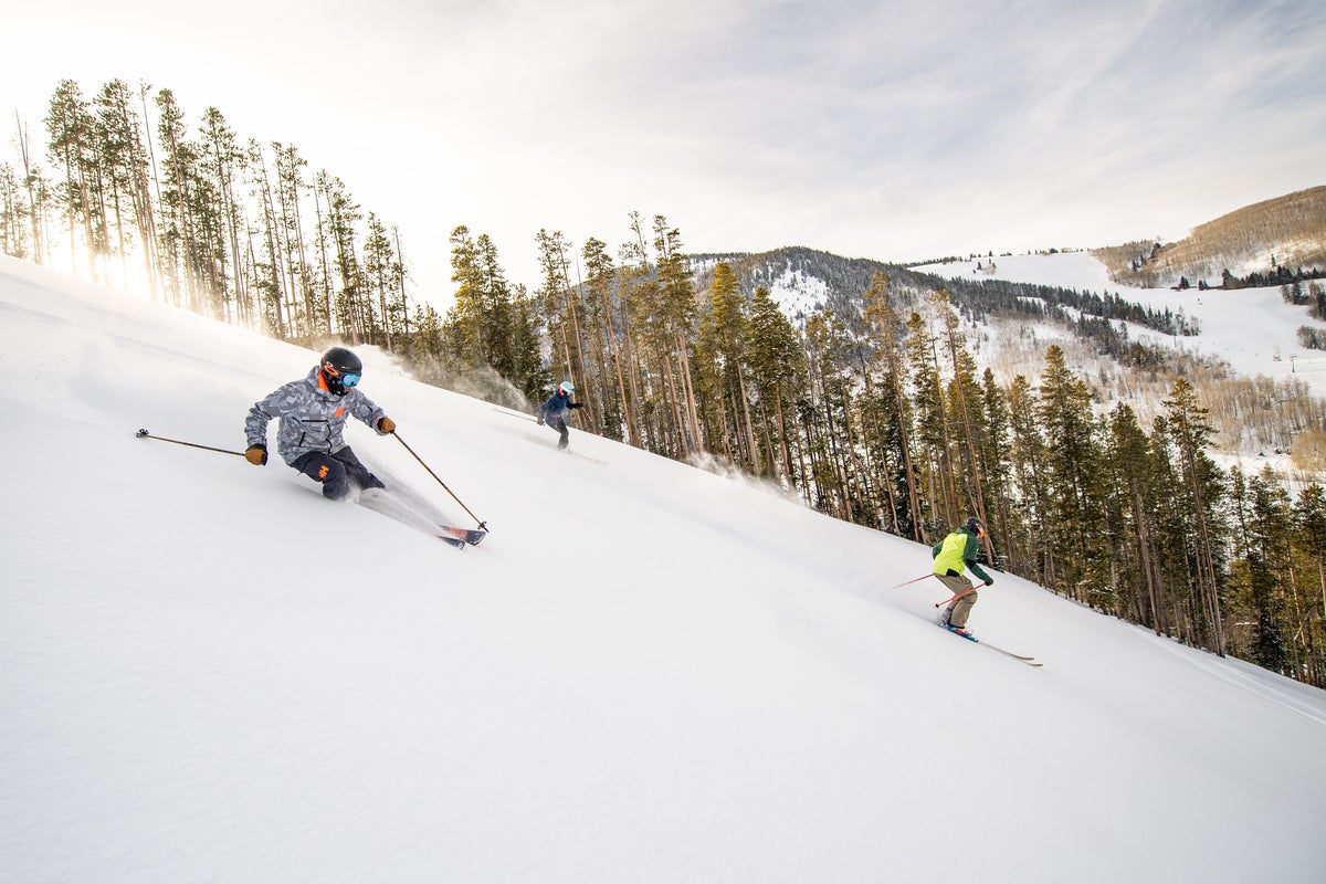 Group of skiers skiing down slopes at Beaver Creek.