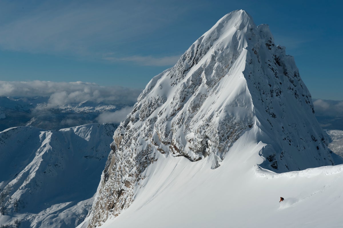 Skiing through untouched powder on a bluebird day at Revelstoke