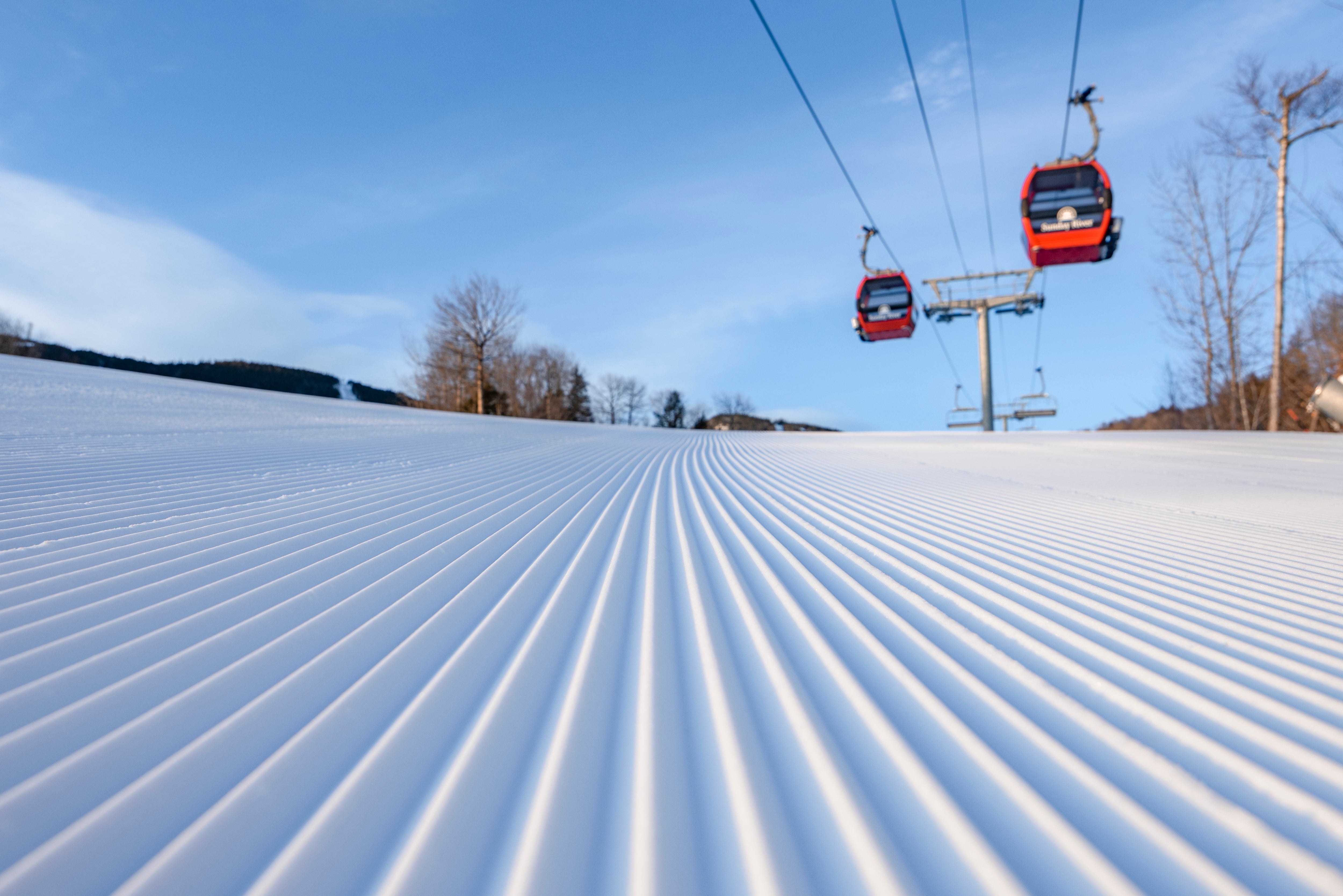 Fresh corduroy on a sunny day below Sunday River gondola