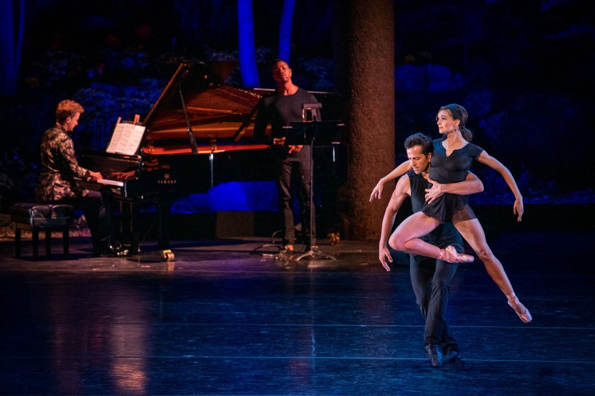 Dancers and musicians performing on stage