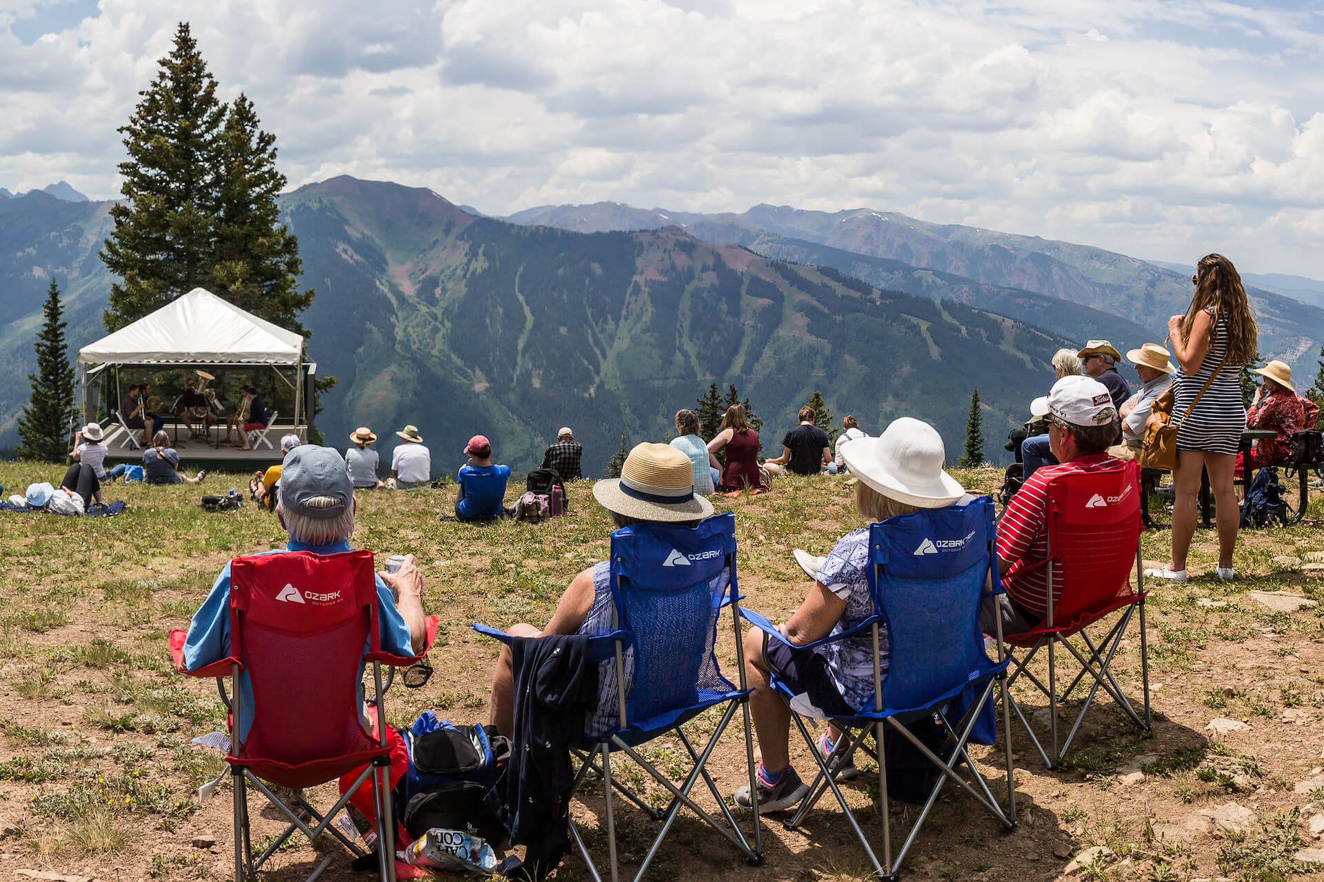 group of people sitting in chairs listening to music on Aspen Mountain