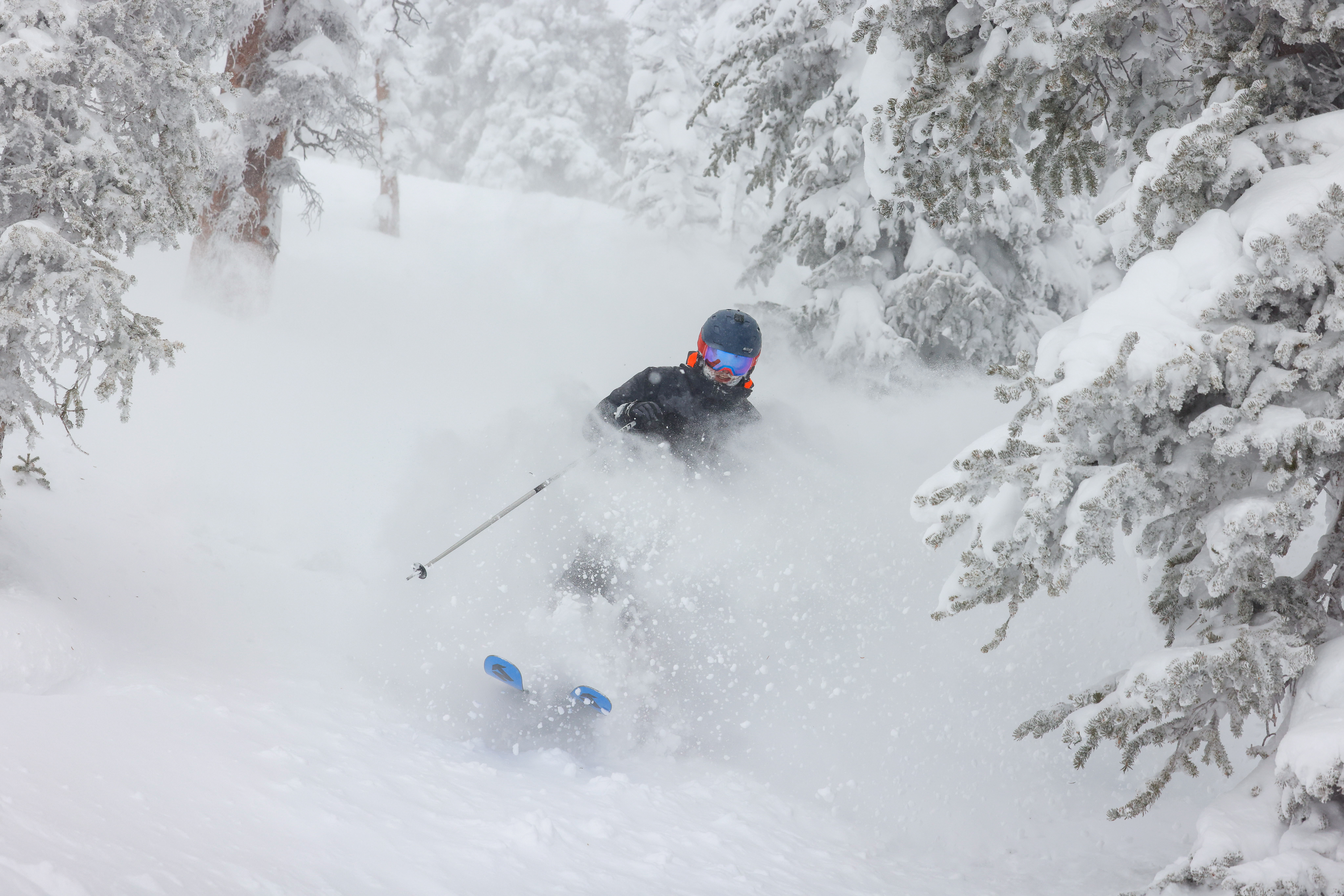 Skiing through deep snow on a powder day