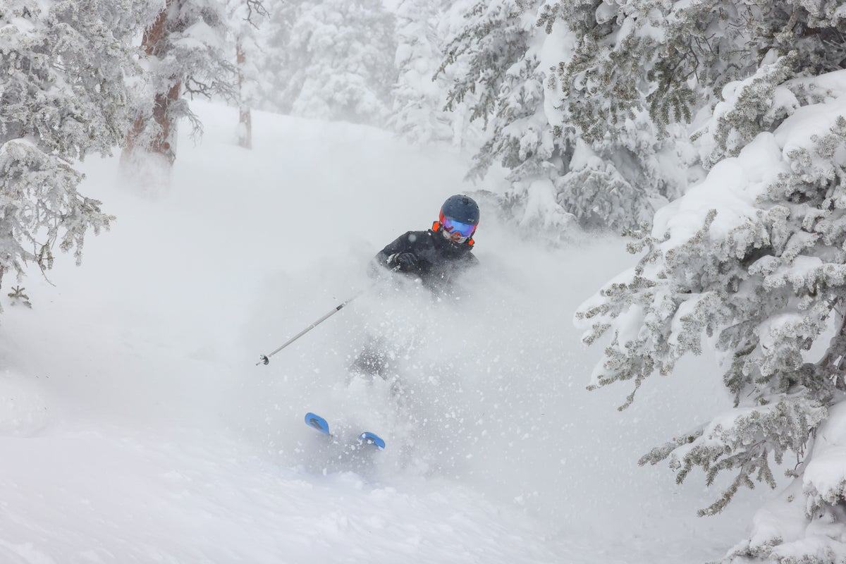 Skiing through deep snow on a powder day