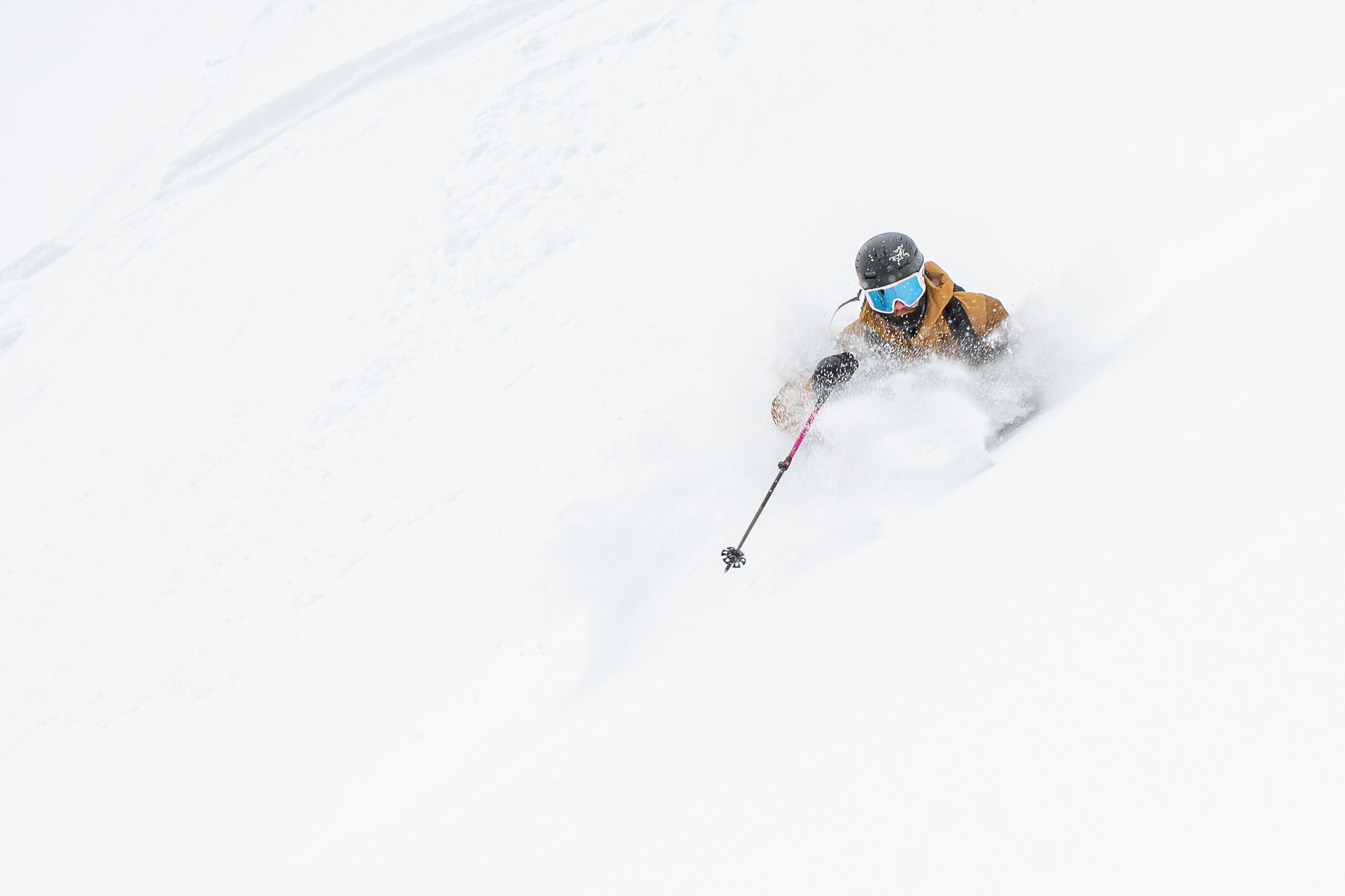 Skiing through deep powder on a powder day