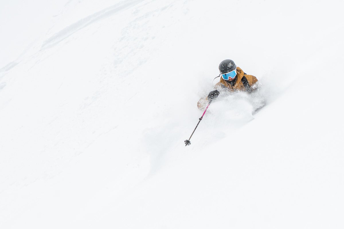 Skiing through deep powder on a powder day