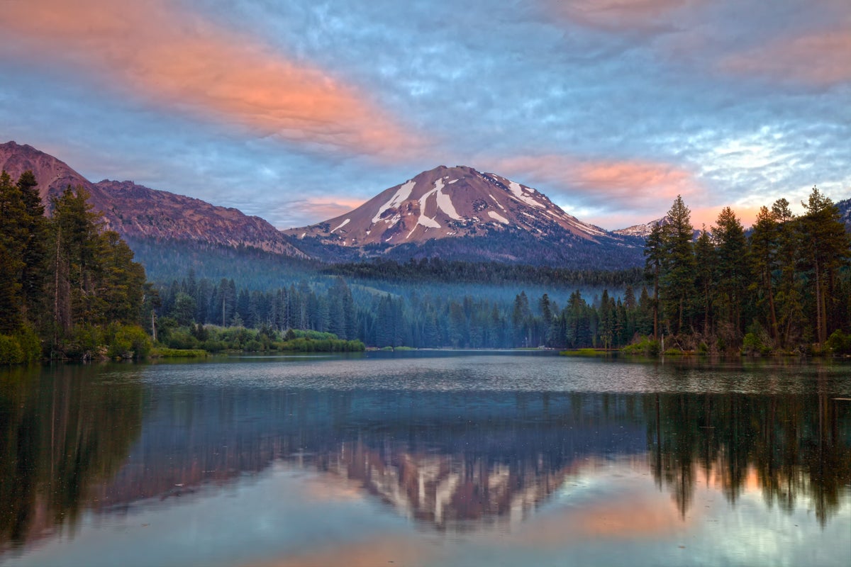 Reflection of Mt. Lassen off of lake at sunset during the summer